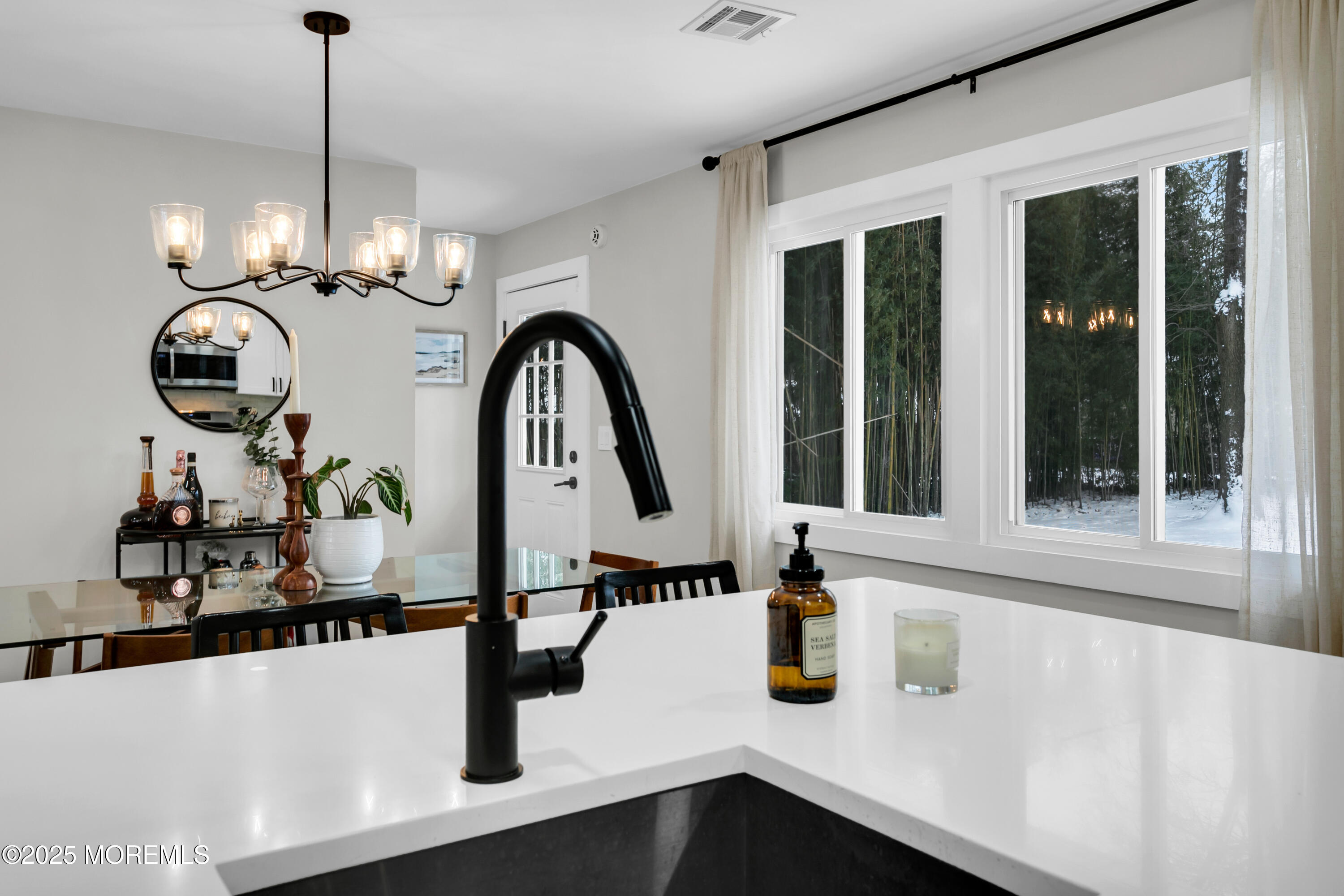 197 Oak Hill Road Red Bank, NJ 07701 - Photo 11 of 26 a kitchen with a sink and chandelier