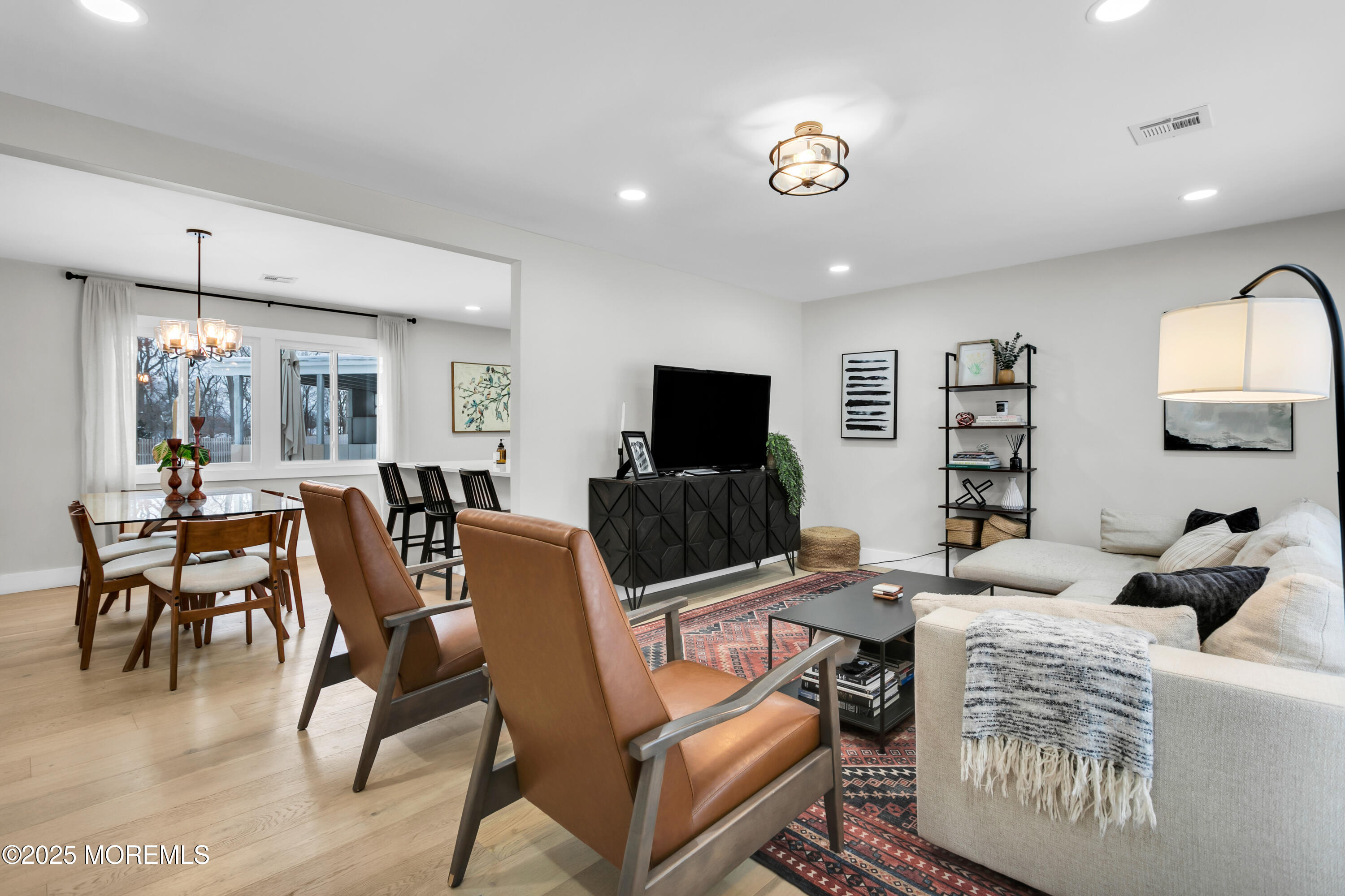 197 Oak Hill Road Red Bank, NJ 07701 - Photo 6 of 26 a living room with furniture a flat screen tv and a window