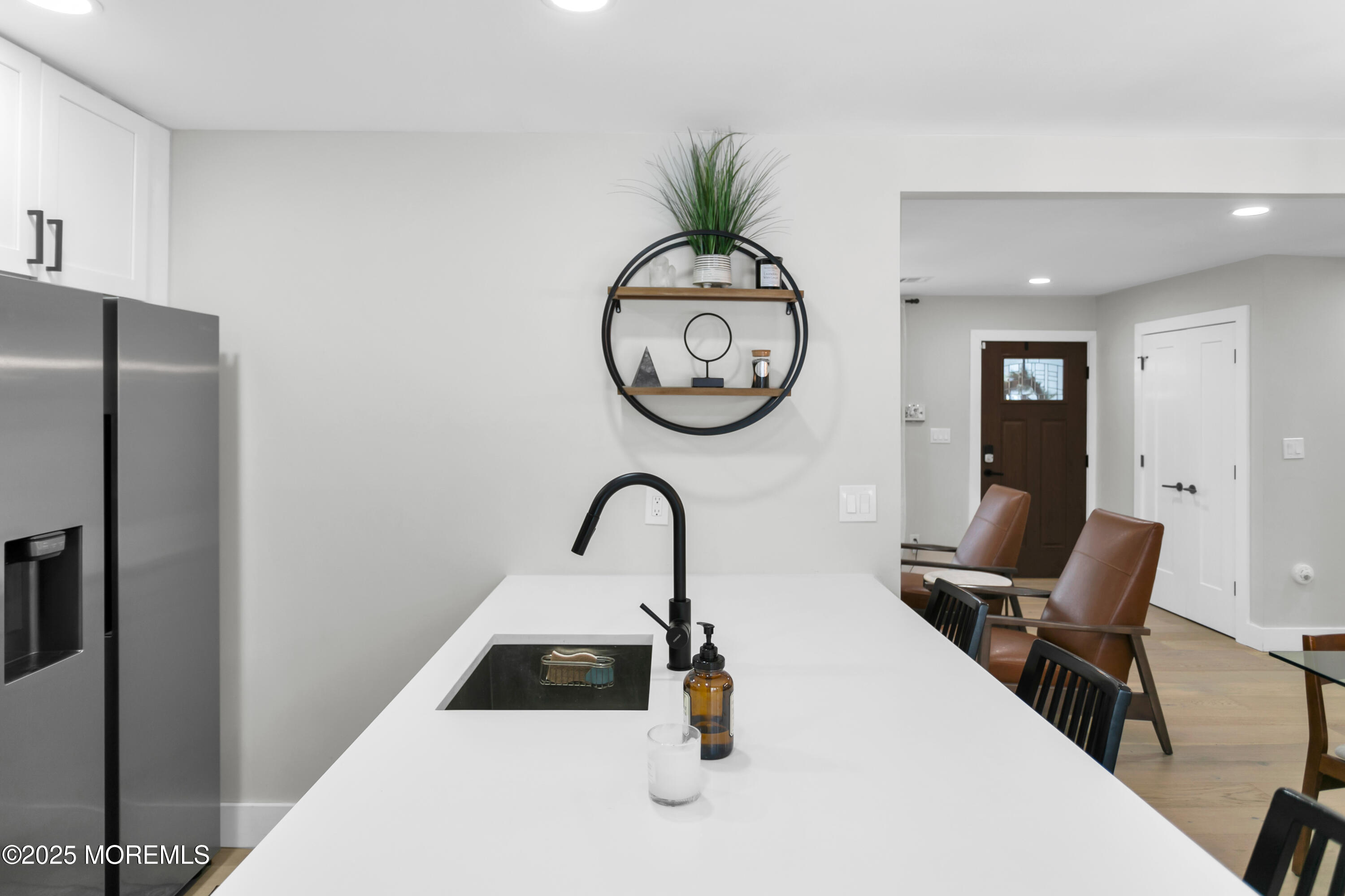 197 Oak Hill Road Red Bank, NJ 07701 - Photo 9 of 26 a table with a chair and a large window