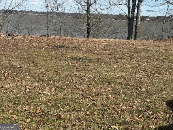 a view of snow in middle of yard