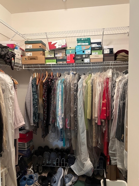 1 Riverview Boulevard, Unit 38 Methuen, MA 01844 - Photo 21 of 41 a view of walk in closet with clothes and shoes