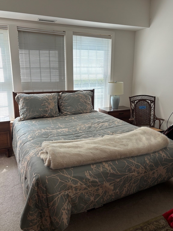1 Riverview Boulevard, Unit 38 Methuen, MA 01844 - Photo 22 of 41 a bedroom with a bed and window