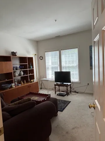 a workspace with furniture and a book shelf