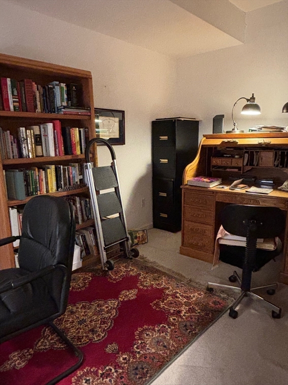 1 Riverview Boulevard, Unit 38 Methuen, MA 01844 - Photo 25 of 41 a workspace with furniture and a book shelf