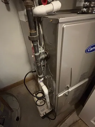 a front view of a house with a yard table and chairs