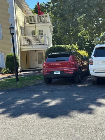 a sign board with a house