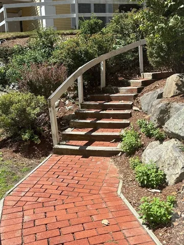 a view of entryway with flower plants
