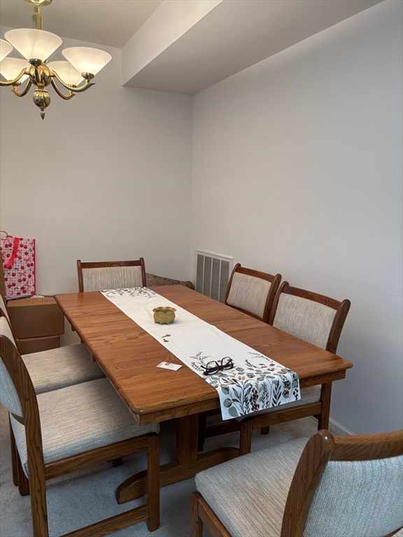 1 Riverview Boulevard, Unit 38 Methuen, MA 01844 - Photo 9 of 41 a bedroom with a bed and a table