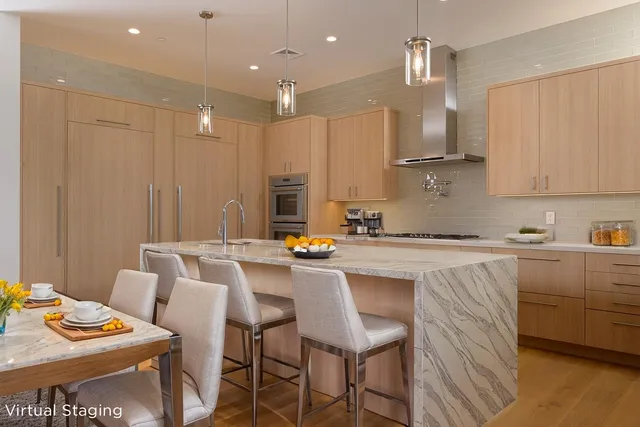 a kitchen with stainless steel appliances kitchen island granite countertop a sink and cabinets