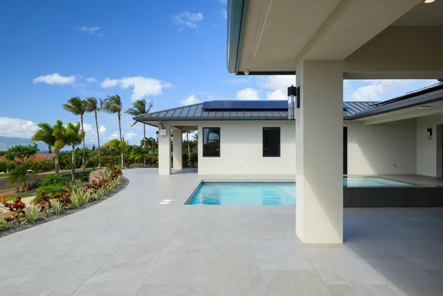 a view of a house with porch and furniture