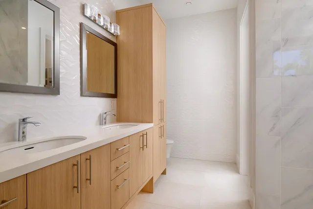 a view of a hallway with paintings on the wall