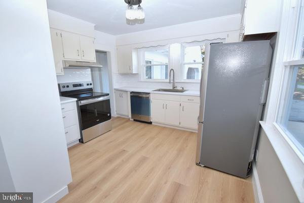 286 State Road West Grove, PA 19390 - Photo 13 of 53 a kitchen with cabinets and stainless steel appliances