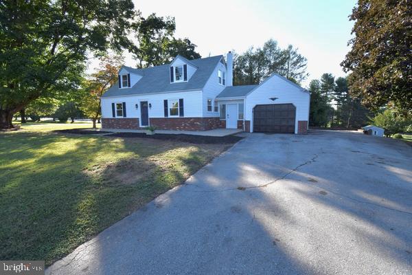 286 State Road West Grove, PA 19390 - Photo 3 of 53 a front view of a house with yard