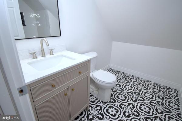 286 State Road West Grove, PA 19390 - Photo 35 of 53 a bathroom with a toilet a sink and mirror