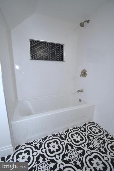 286 State Road West Grove, PA 19390 - Photo 36 of 53 a bathroom with a bathtub and a shower