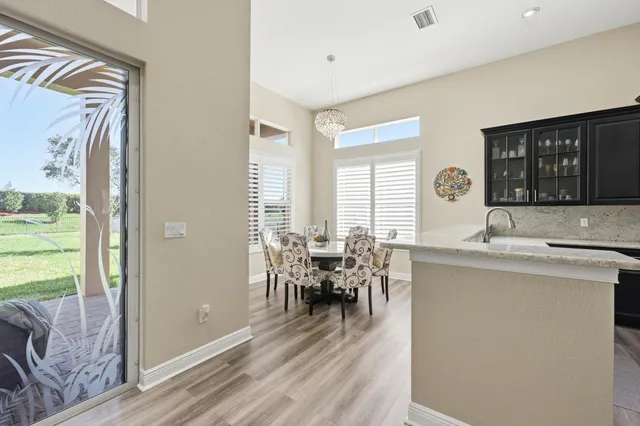 a spacious bedroom with a bed and a flat screen tv