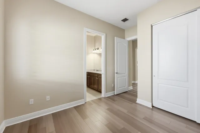 a view of workspace with wooden floor and windows