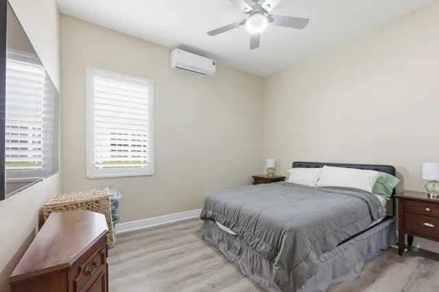 a view of a hallway view with wooden floor and living room