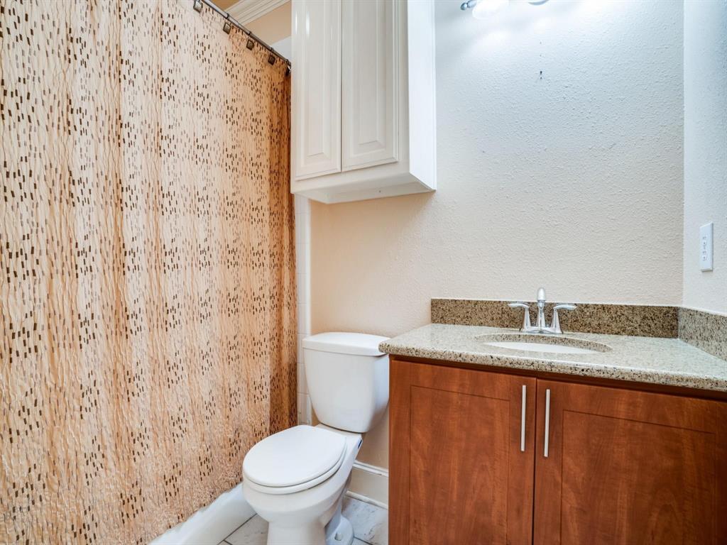 5707 Lewis Street Dallas, TX 75206 - Photo 10 of 11 Full bath with vanity and curtained shower