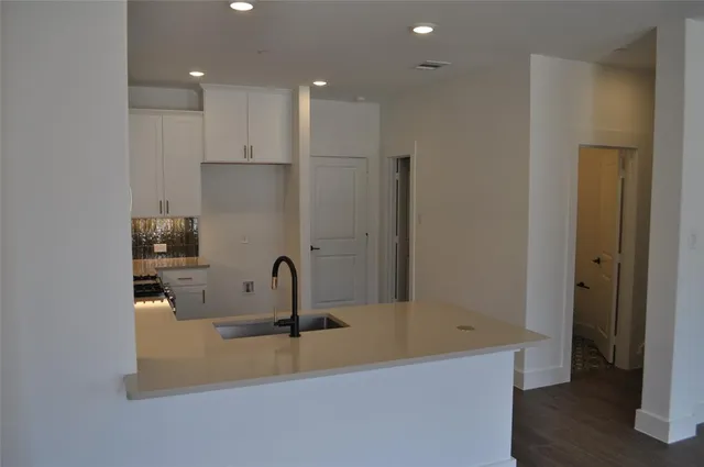 a bathroom with a sink and mirror