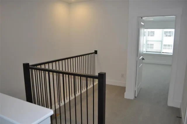 a view of a hallway with a window