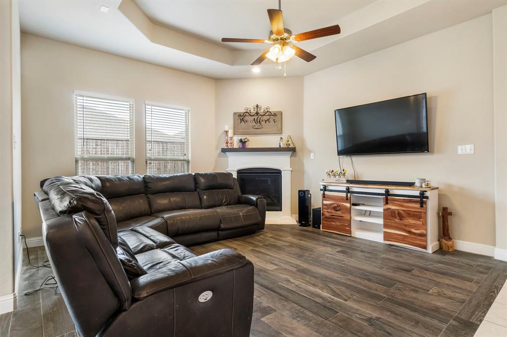 3610 Bastrop Street Melissa, TX 75454 - Photo 7 of 23 a living room with furniture and a flat screen tv