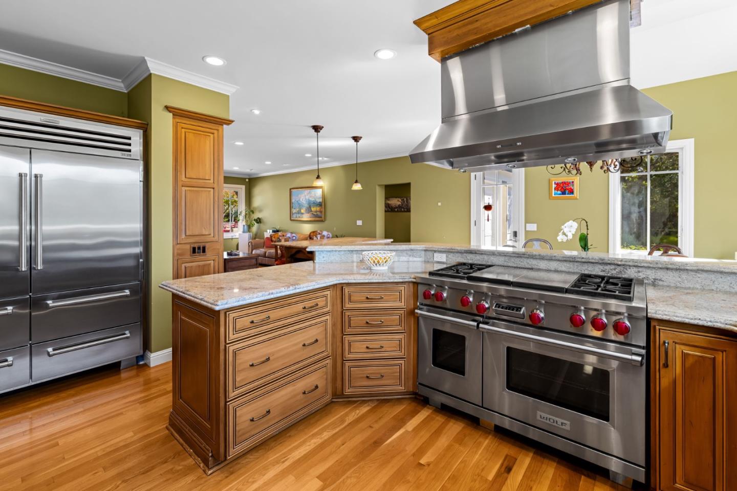 3937 Ronda Road Pebble Beach, CA 93953 - Photo 16 of 25 a kitchen with stainless steel appliances granite countertop a stove and a refrigerator