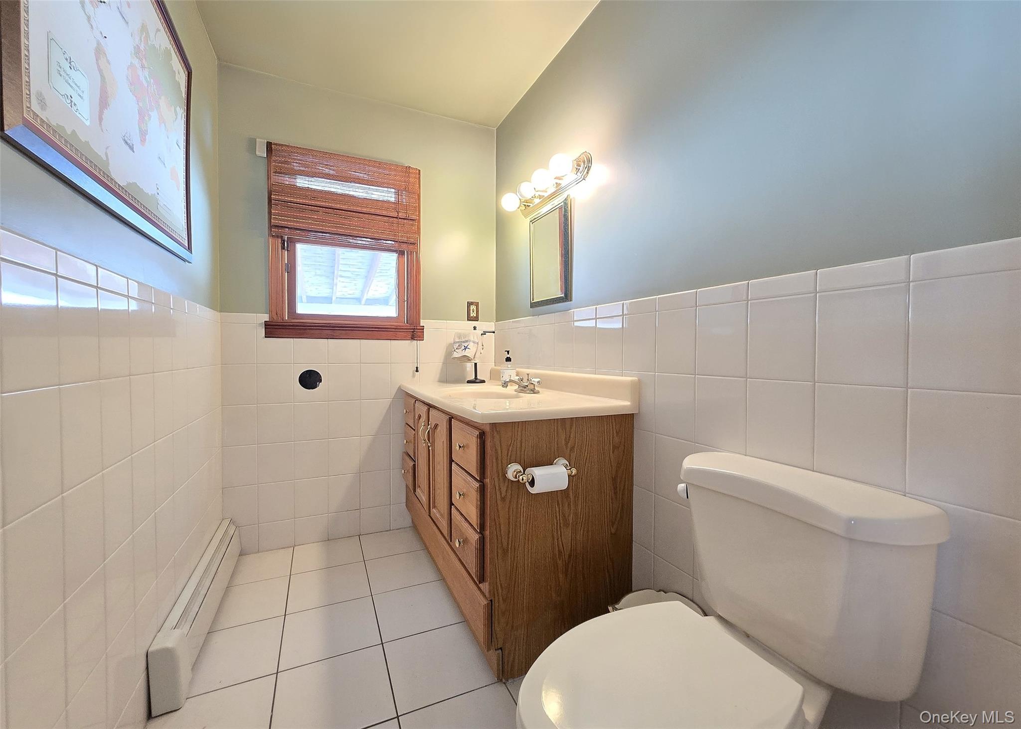 4 Cameo Road Commack, NY 11725 - Photo 11 of 23 a bathroom with a sink a toilet and shower