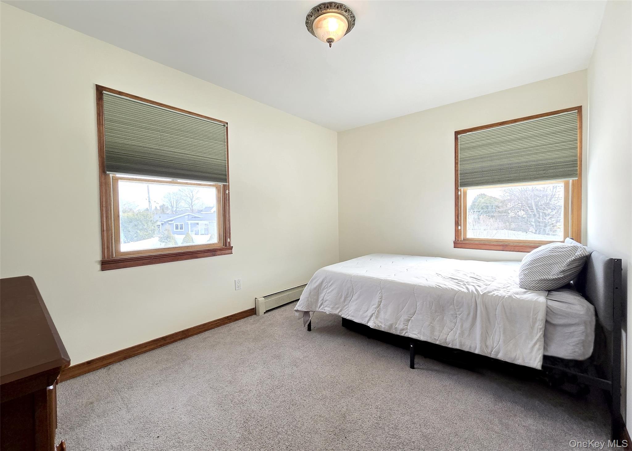 4 Cameo Road Commack, NY 11725 - Photo 13 of 23 a bedroom with a bed and window