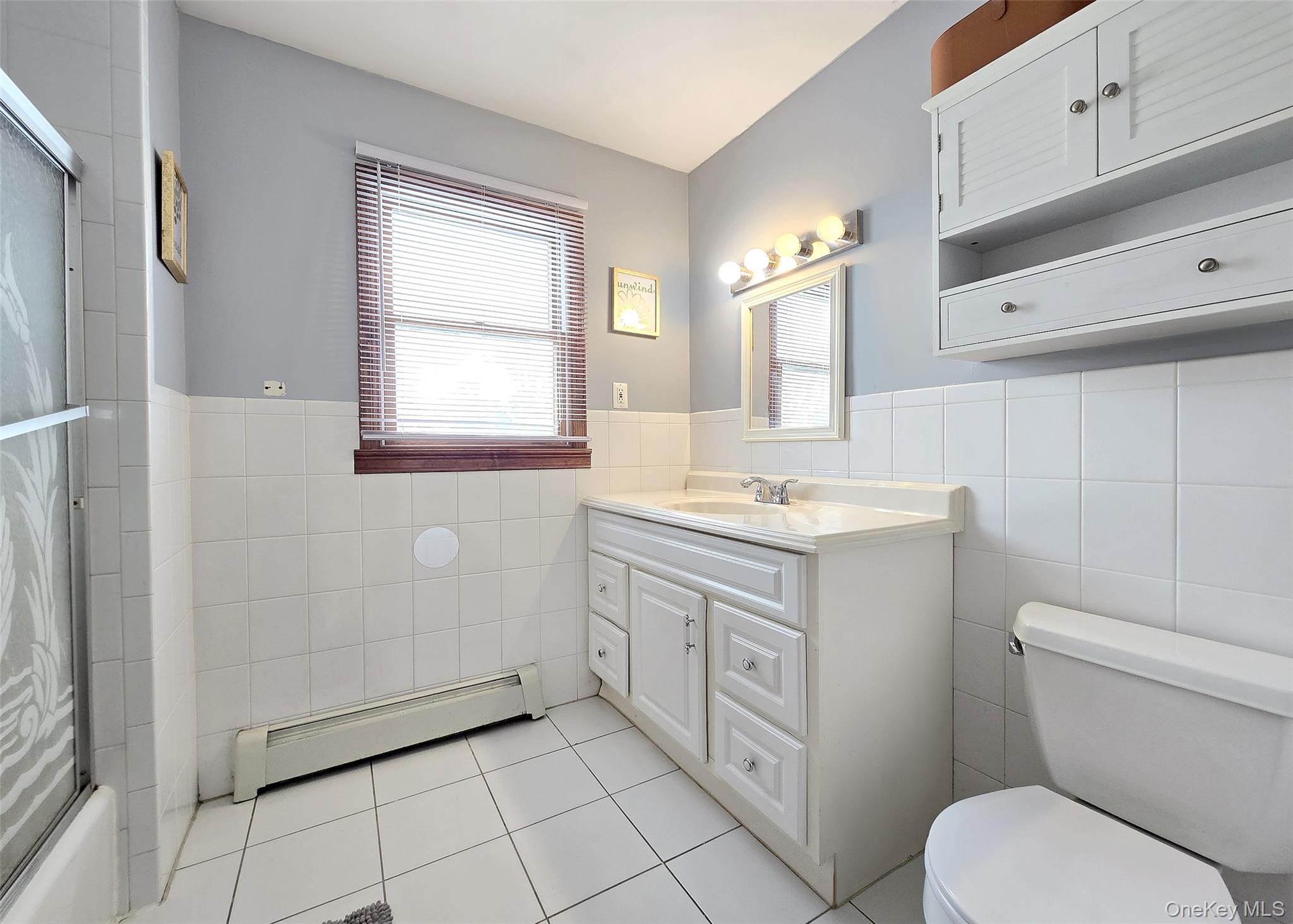 4 Cameo Road Commack, NY 11725 - Photo 15 of 23 a bathroom with a granite countertop toilet a sink and a mirror