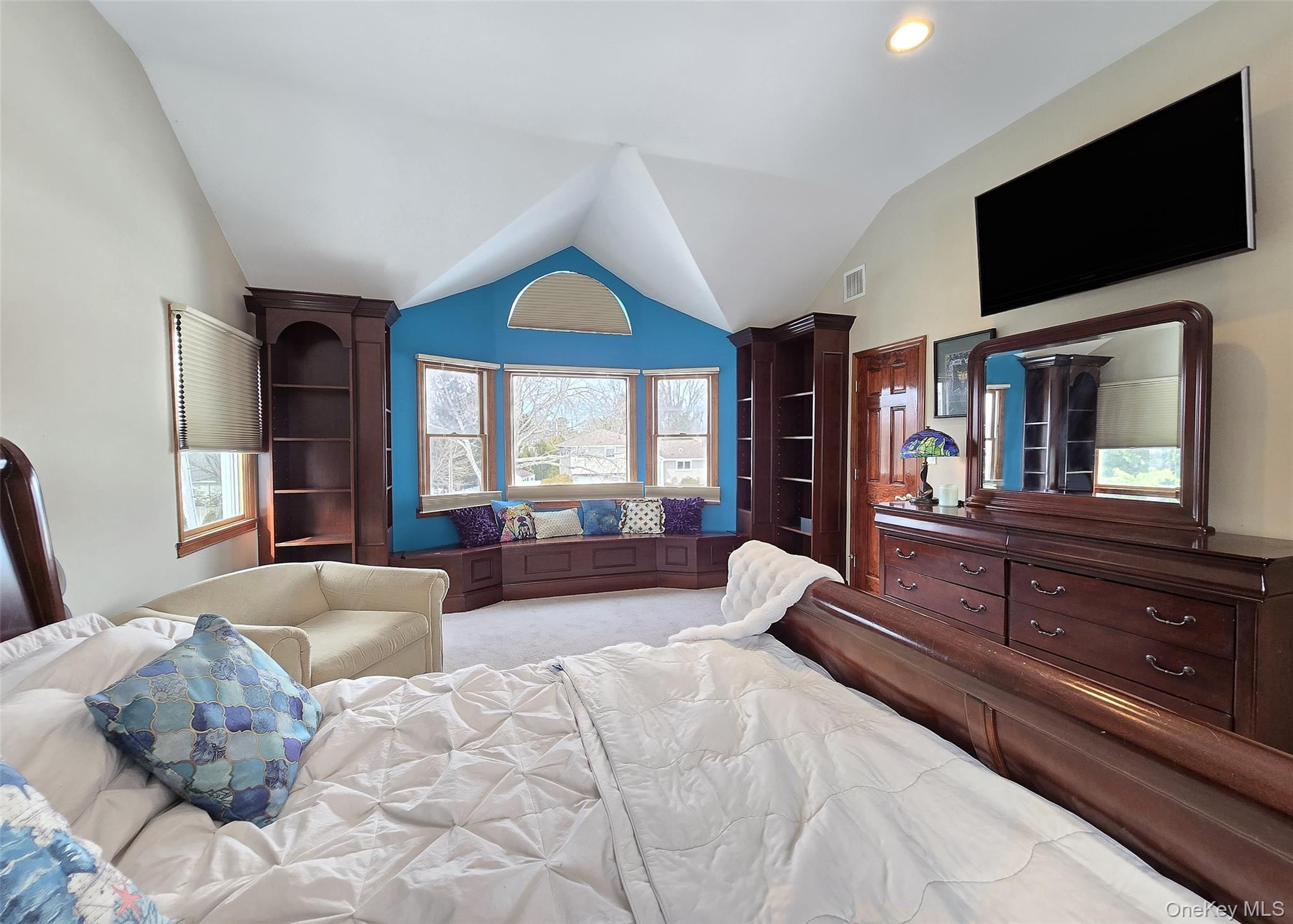 4 Cameo Road Commack, NY 11725 - Photo 19 of 23 a spacious bedroom with a large bed and a flat screen tv