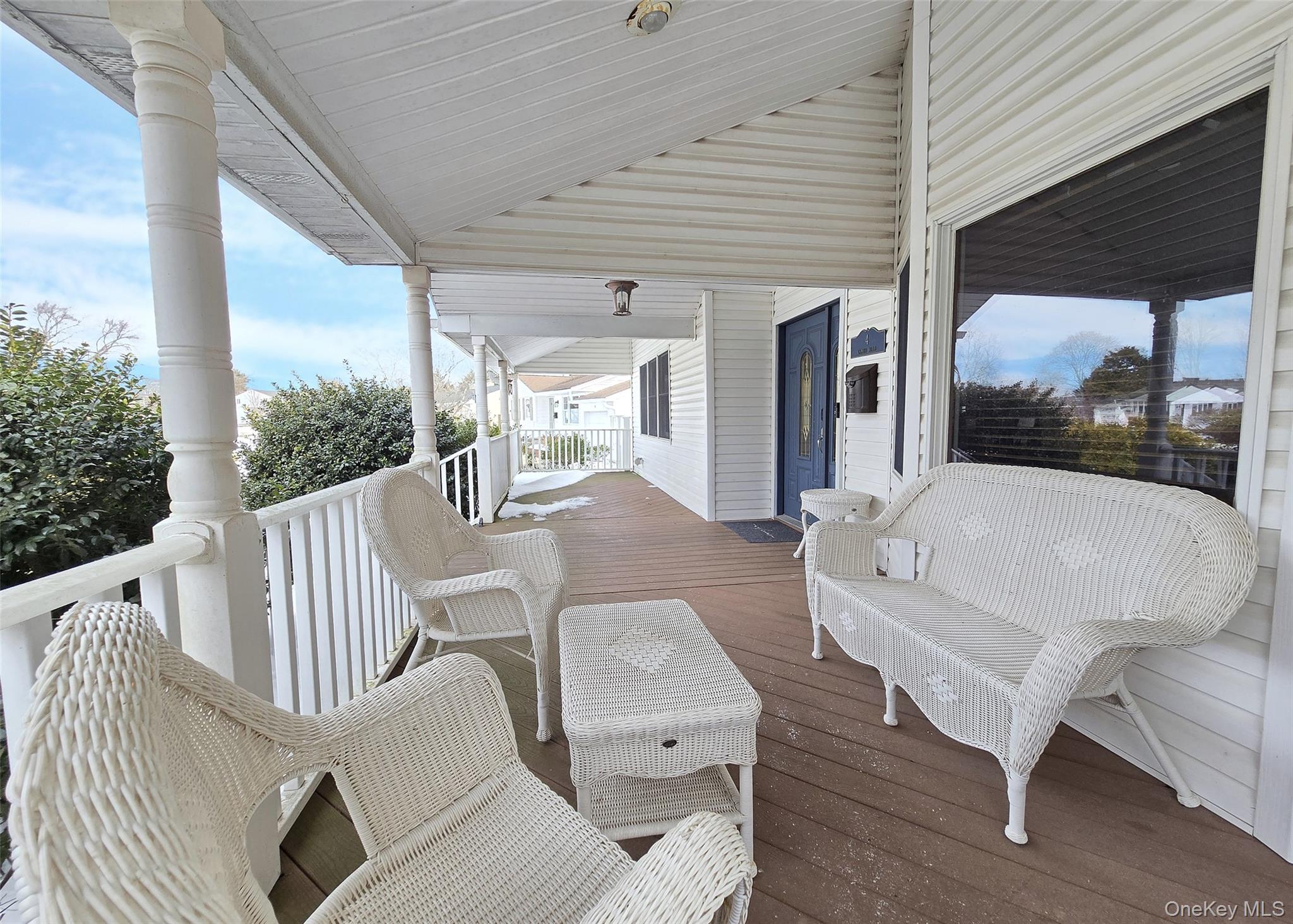 4 Cameo Road Commack, NY 11725 - Photo 20 of 23 a balcony with furniture and a floor to ceiling window