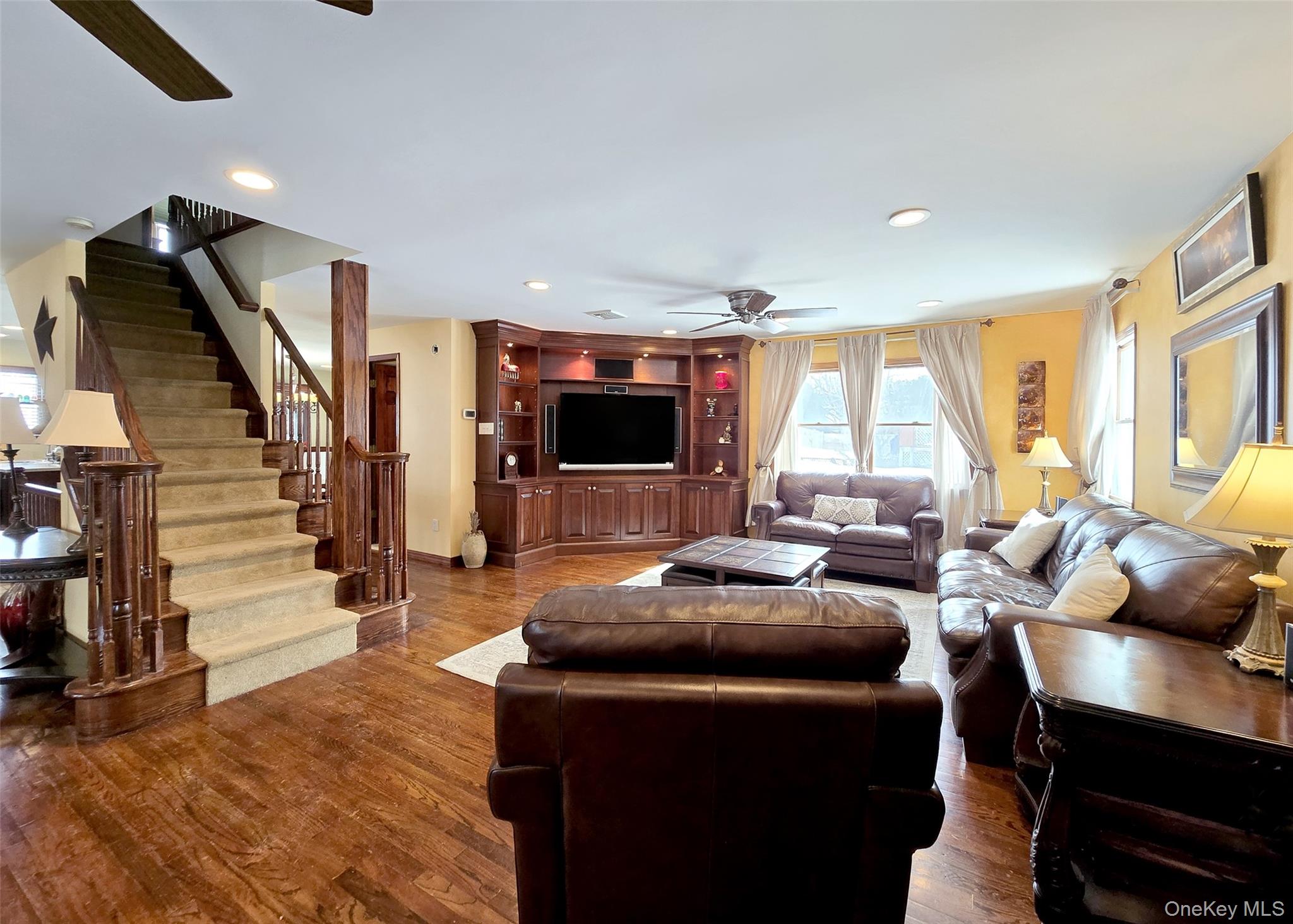 4 Cameo Road Commack, NY 11725 - Photo 8 of 23 a living room with furniture and a flat screen tv