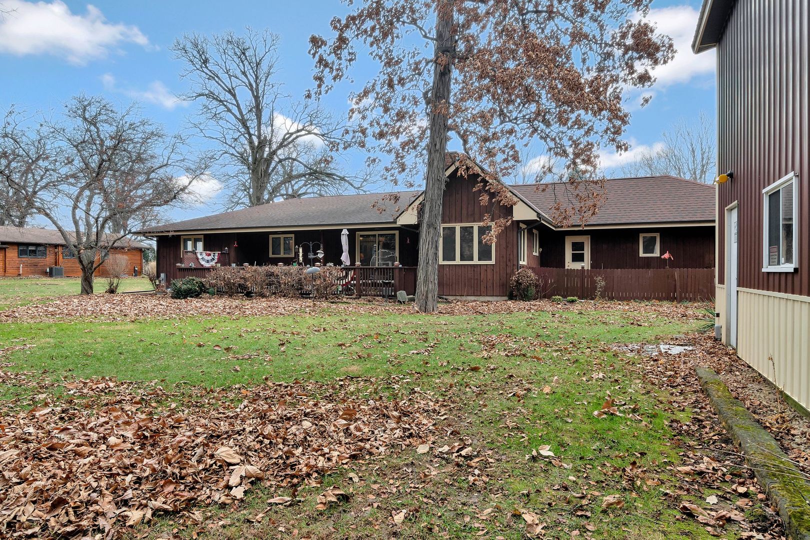 3805 West Sandwich Road Sandwich, IL 60548 - Photo 22 of 28 a front view of a house with a yard