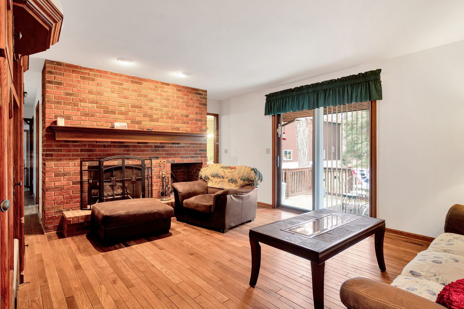3805 West Sandwich Road Sandwich, IL 60548 - Photo 6 of 28 a living room with furniture and a fireplace