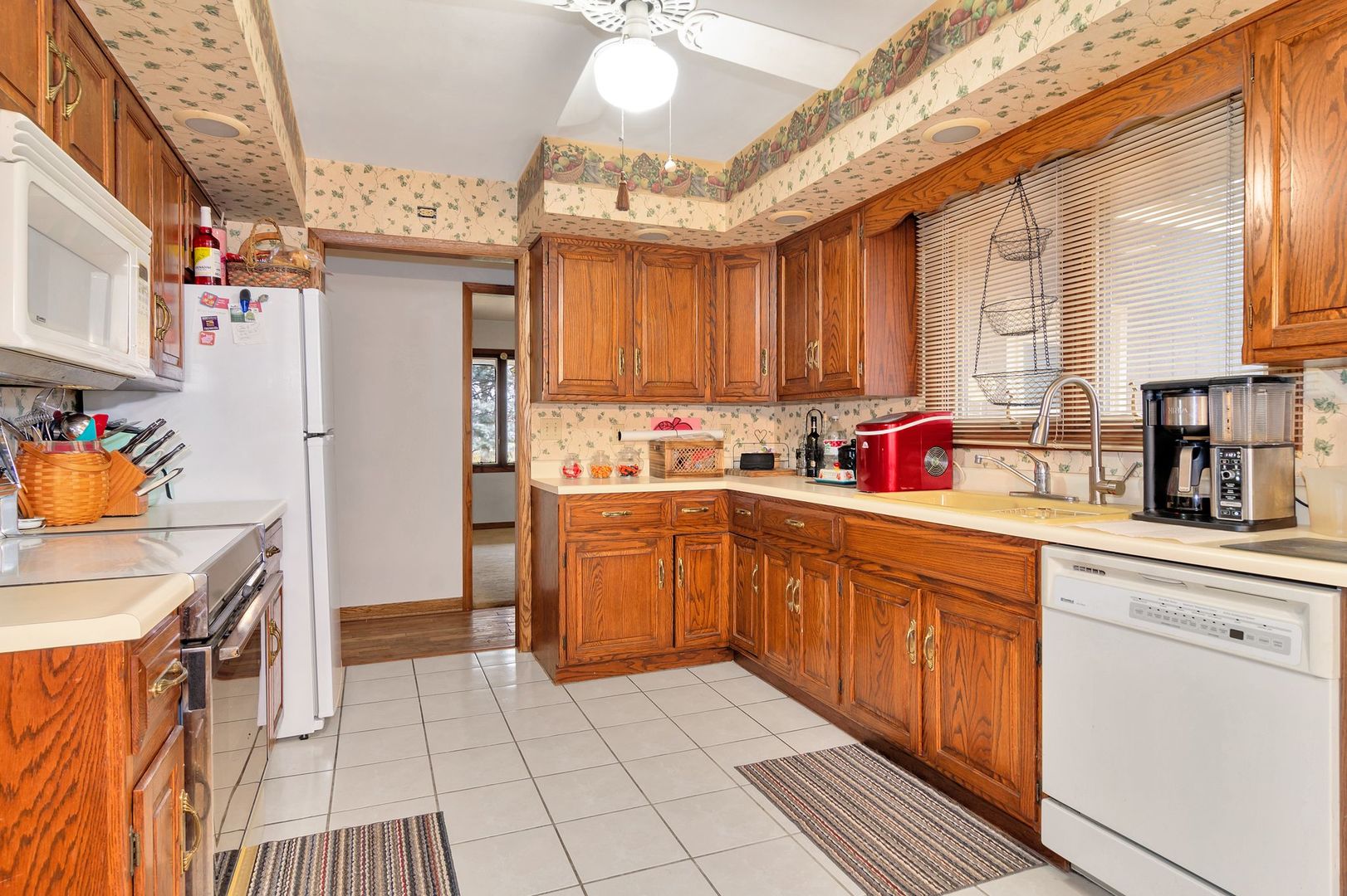 3805 West Sandwich Road Sandwich, IL 60548 - Photo 9 of 28 a kitchen with a sink window and cabinets