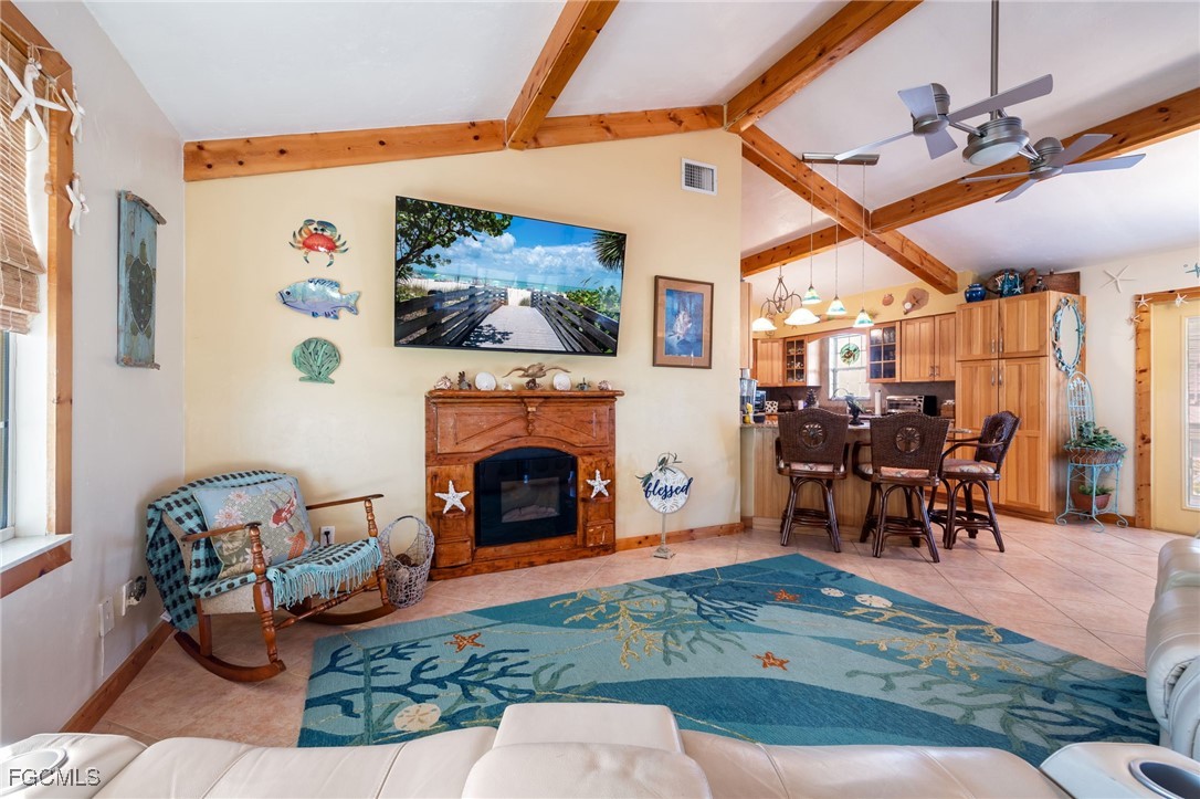3374 York Road St. James City, FL 33956 - Photo 16 of 49 a living room with furniture and a fireplace