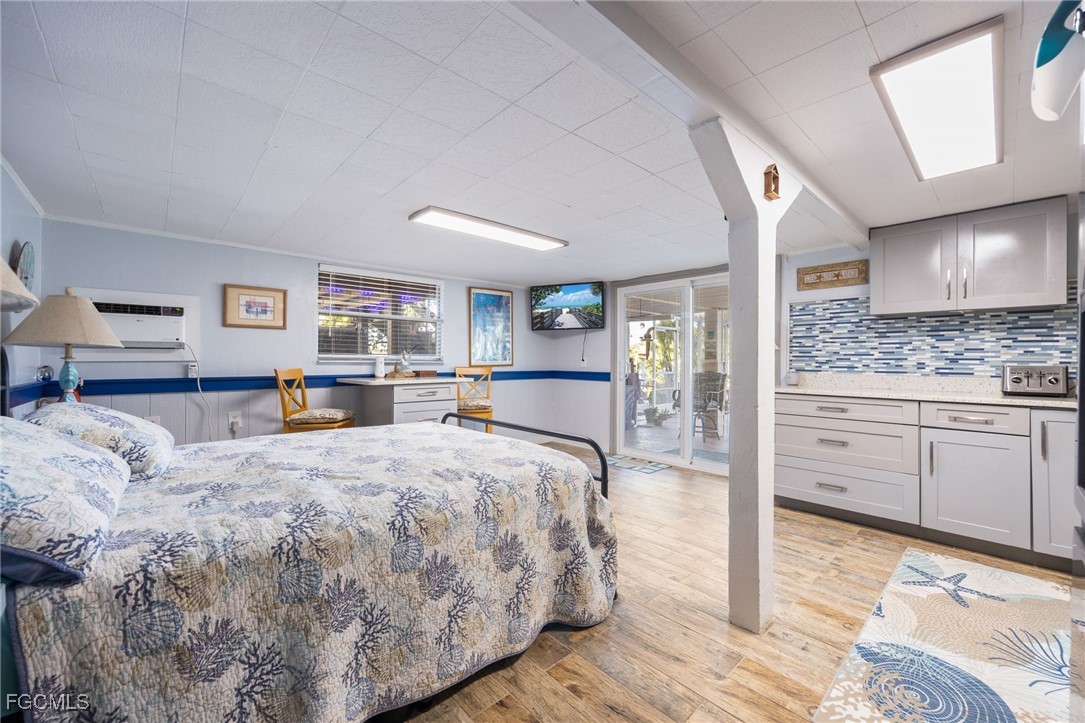 3374 York Road St. James City, FL 33956 - Photo 32 of 49 a bed room with a bed and a cabinets