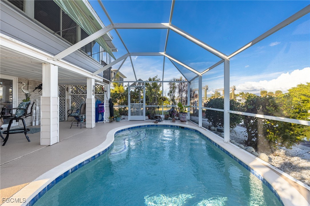 3374 York Road St. James City, FL 33956 - Photo 36 of 49 a view of a swimming pool with a patio