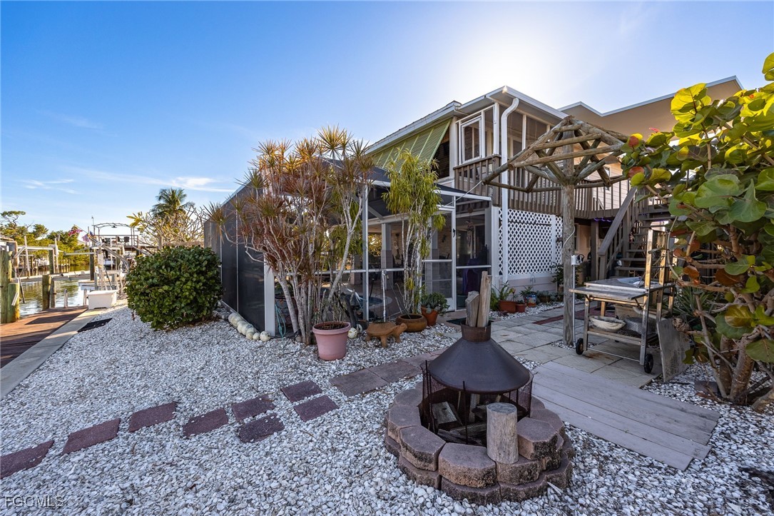3374 York Road St. James City, FL 33956 - Photo 37 of 49 a view of a house with yard and sitting area