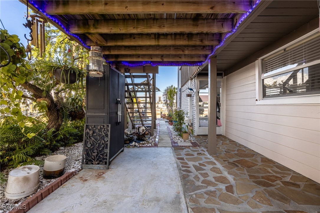 3374 York Road St. James City, FL 33956 - Photo 4 of 49 a front view of a house with outdoor seating