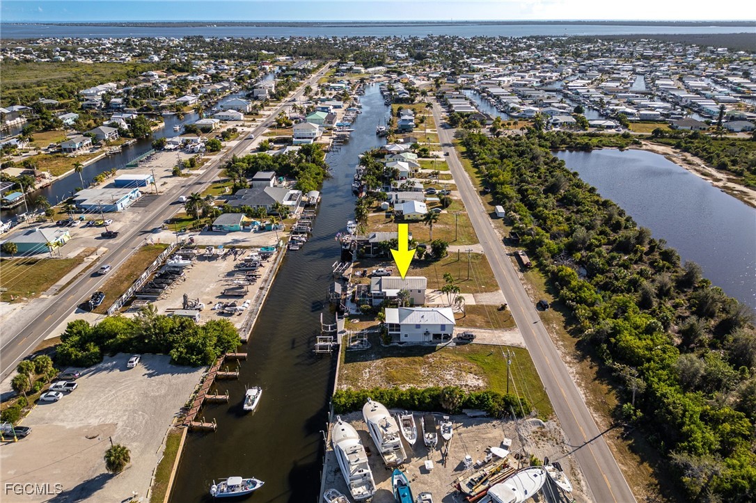 3374 York Road St. James City, FL 33956 - Photo 47 of 49 an aerial view of residential houses with outdoor space