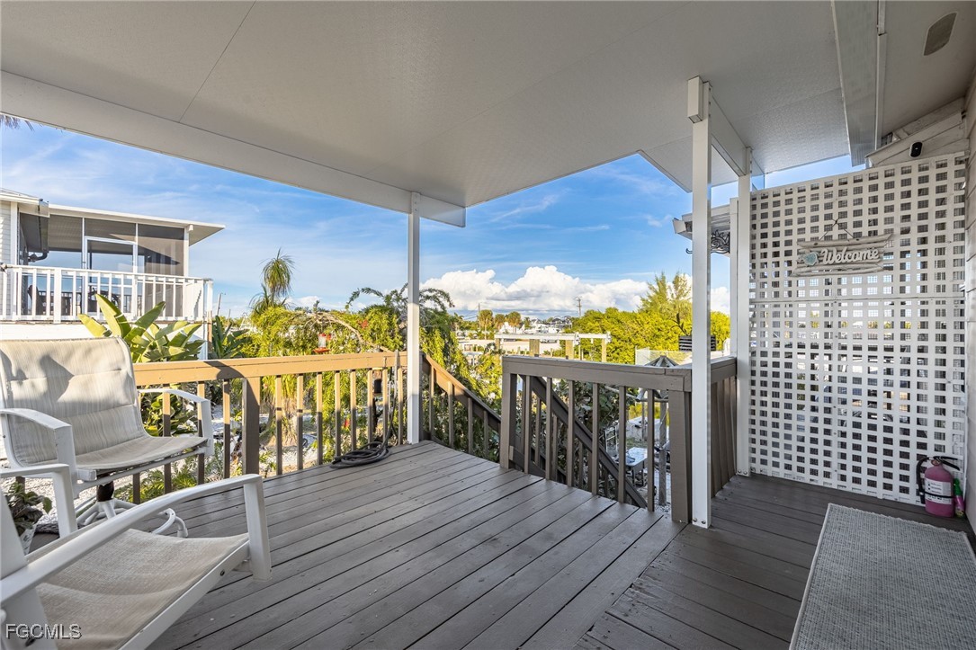 3374 York Road St. James City, FL 33956 - Photo 6 of 49 a view of a balcony with chairs
