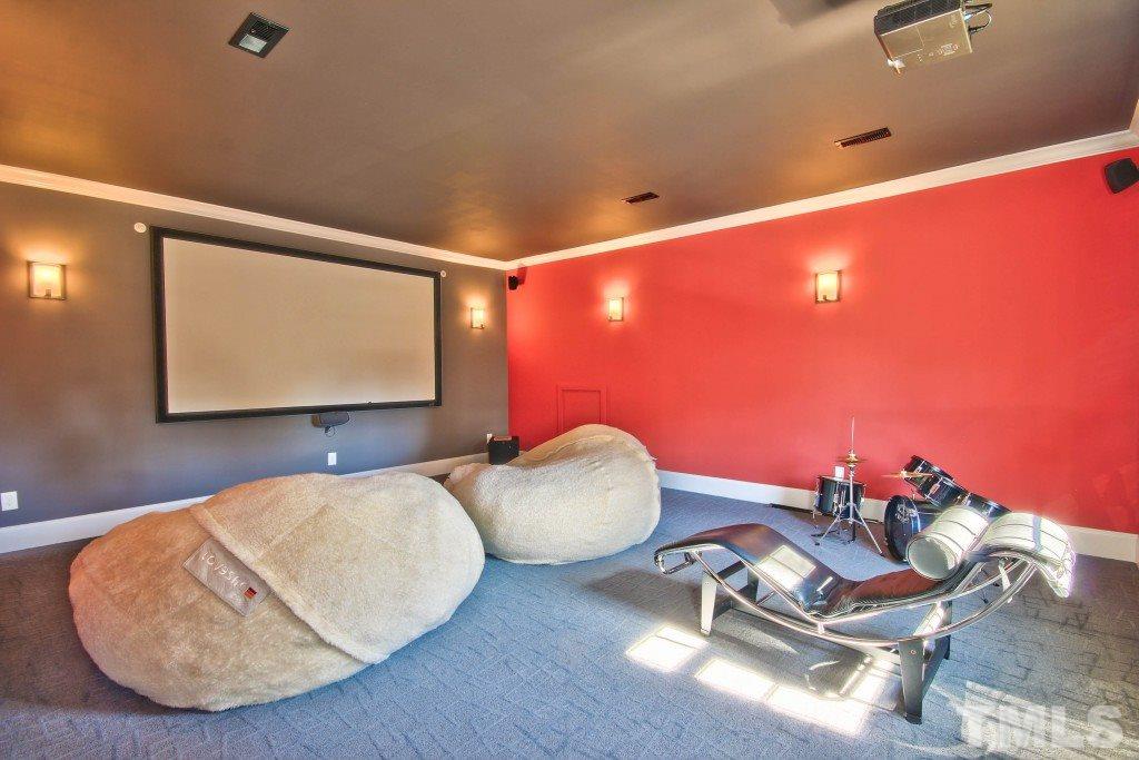 3417 Ebenezer Church Road Raleigh, NC 27612 - Photo 22 of 25 This theater room could also be used as a bonus room or craft room! Features a wet bar with stone back splash and is on the 2nd floor.