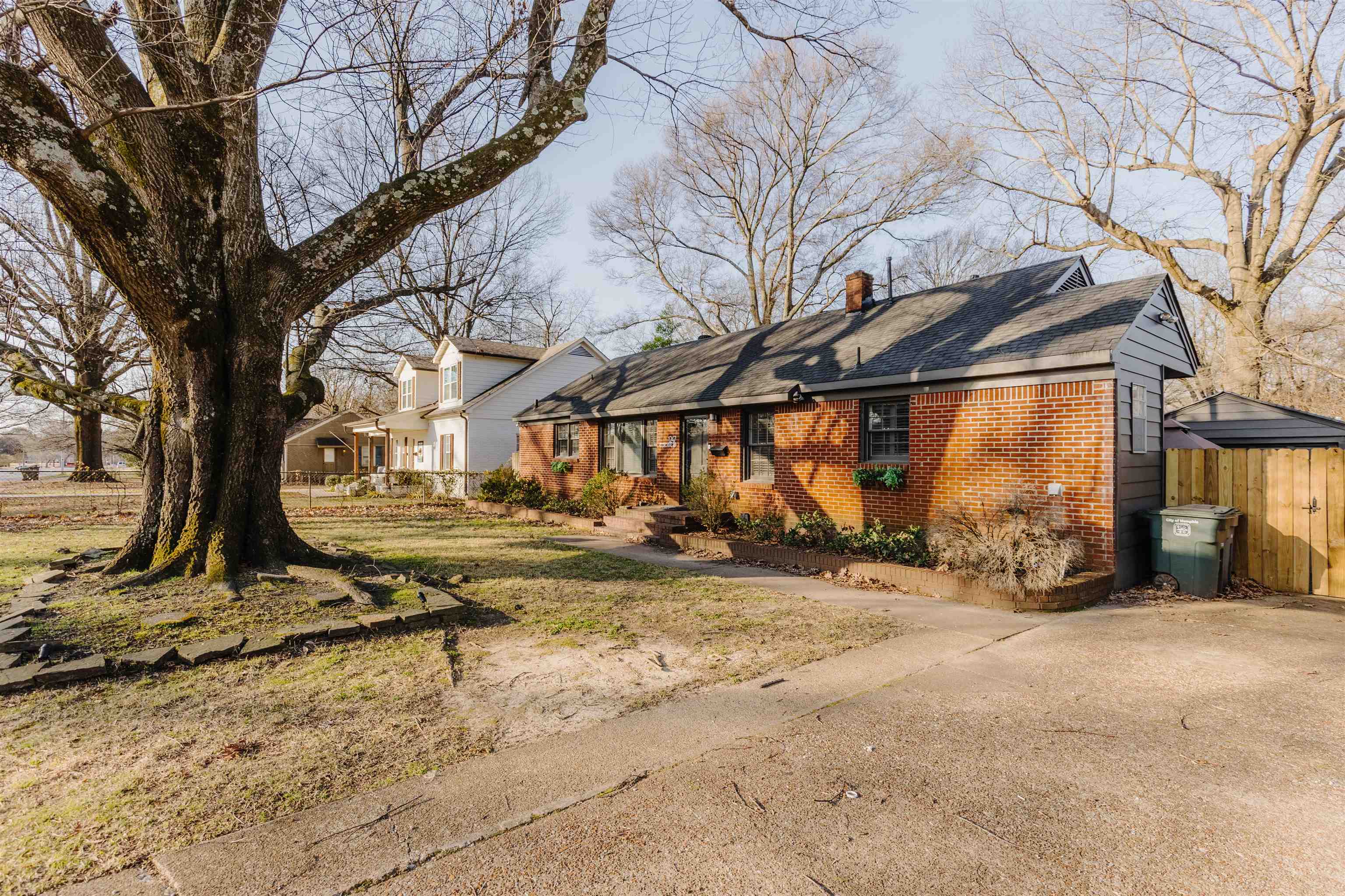 1247 Colonial Road Memphis, TN 38117 - Photo 1 of 29 a view of a yard with wooden fence