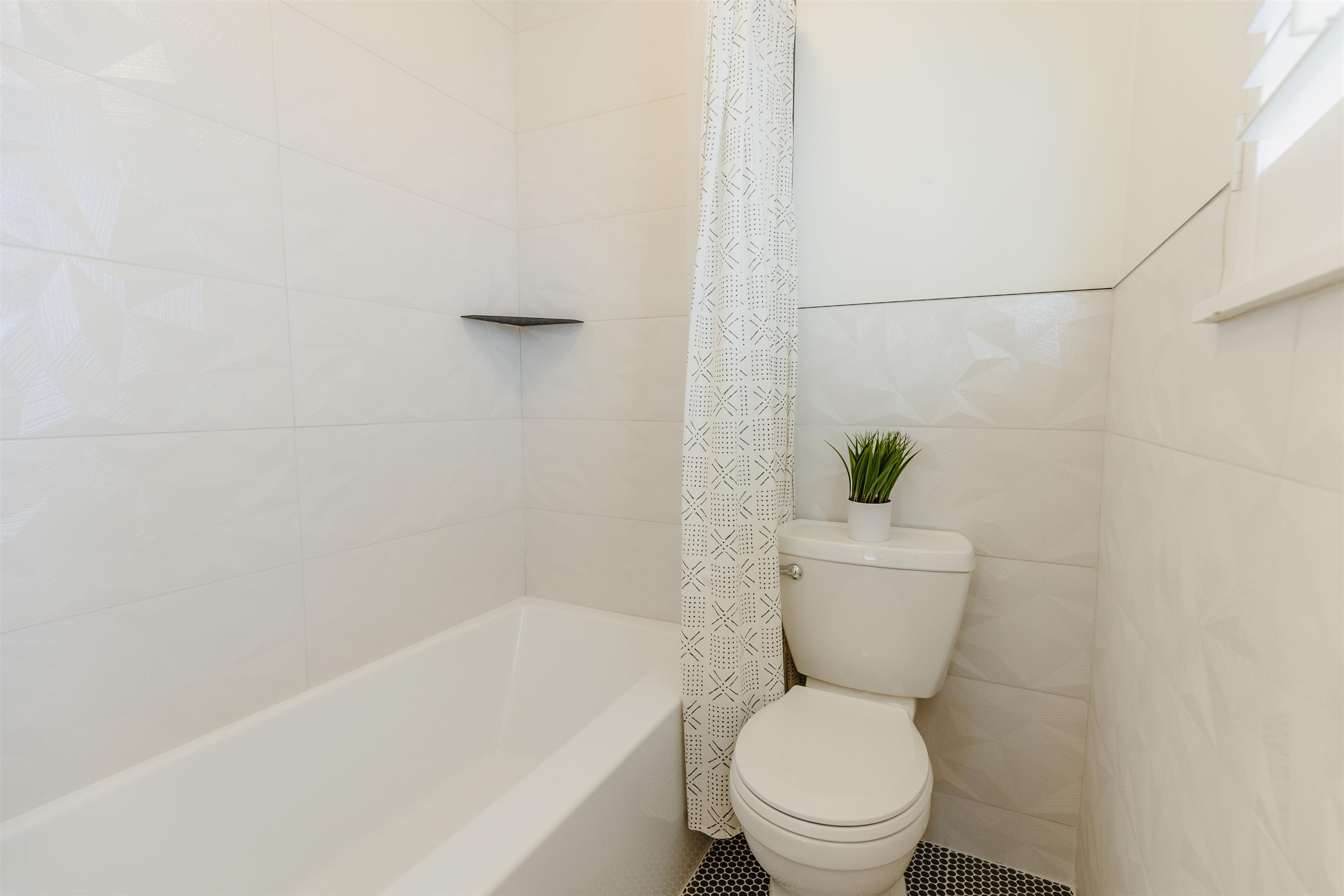 1247 Colonial Road Memphis, TN 38117 - Photo 17 of 29 a white toilet sitting next to a bath tub