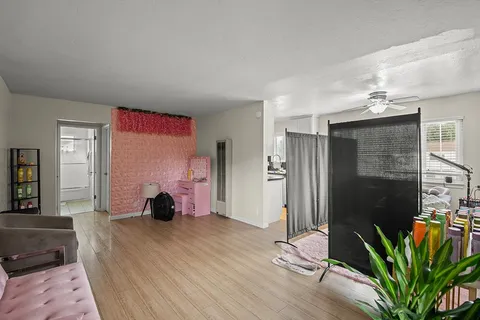 a bedroom with furniture and a potted plant