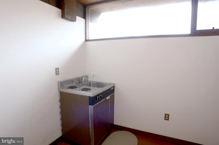 10606 Sweepstakes Road Damascus, MD 20872 - Photo 27 of 30 Storage room has a kitchenette. (As Is)