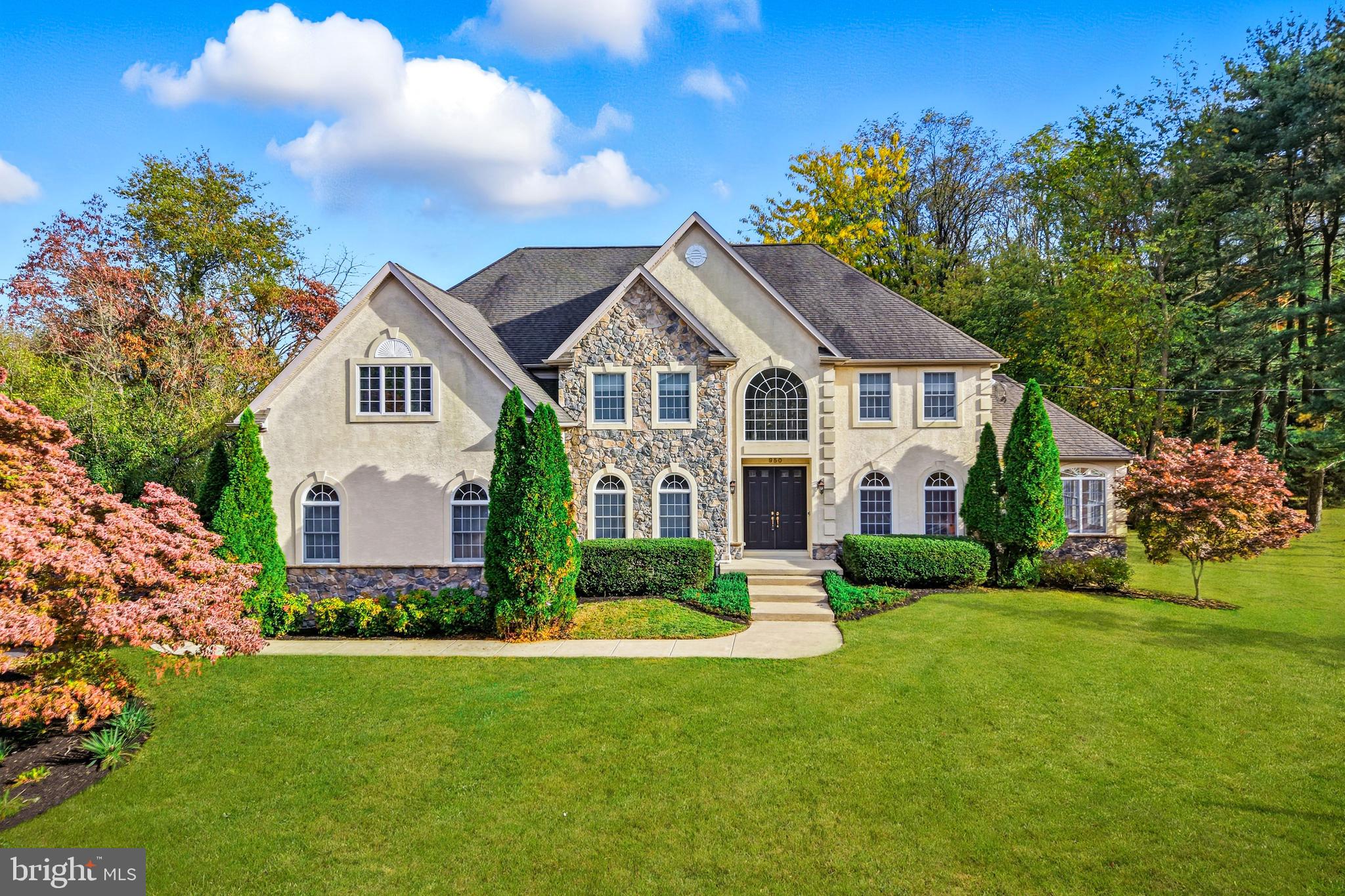 950 Borton Landing Road Moorestown, NJ 08057 - Photo 1 of 53 a front view of a house with a garden and plants