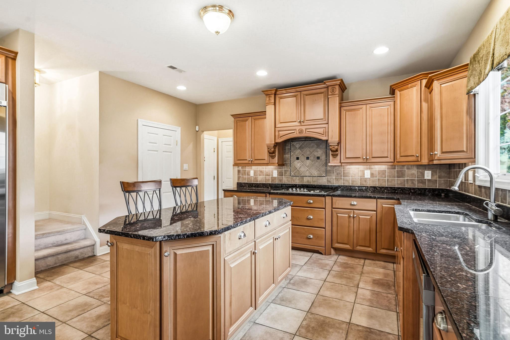 950 Borton Landing Road Moorestown, NJ 08057 - Photo 11 of 53 a kitchen with stainless steel appliances granite countertop a sink stove and cabinets